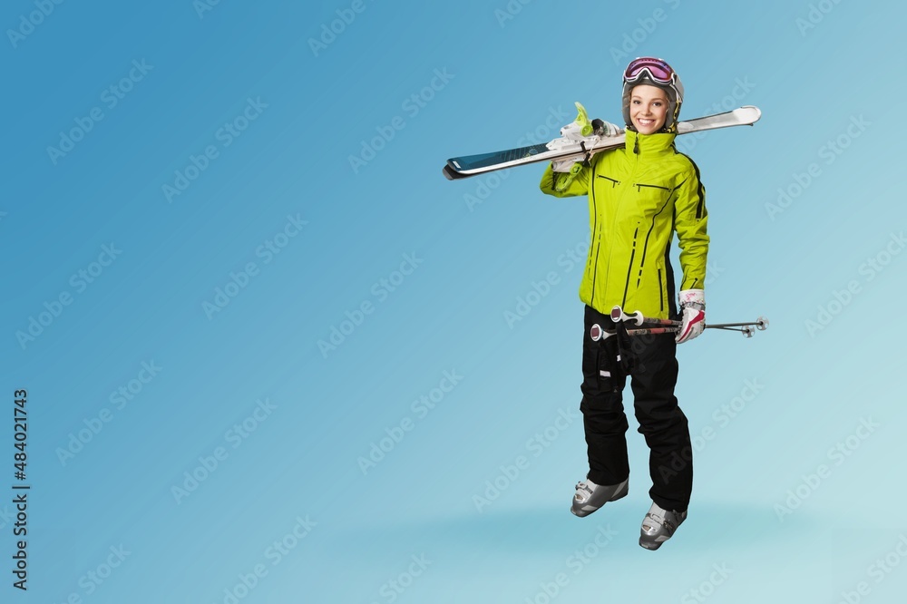 Full body skier smiling happy woman wearing warm jacket spend extreme weekend in mountains