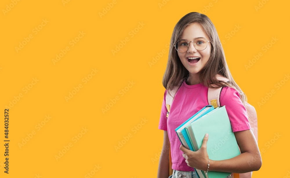 Young happy smart teenager schoolgirl pupil student wearing bag going back to school