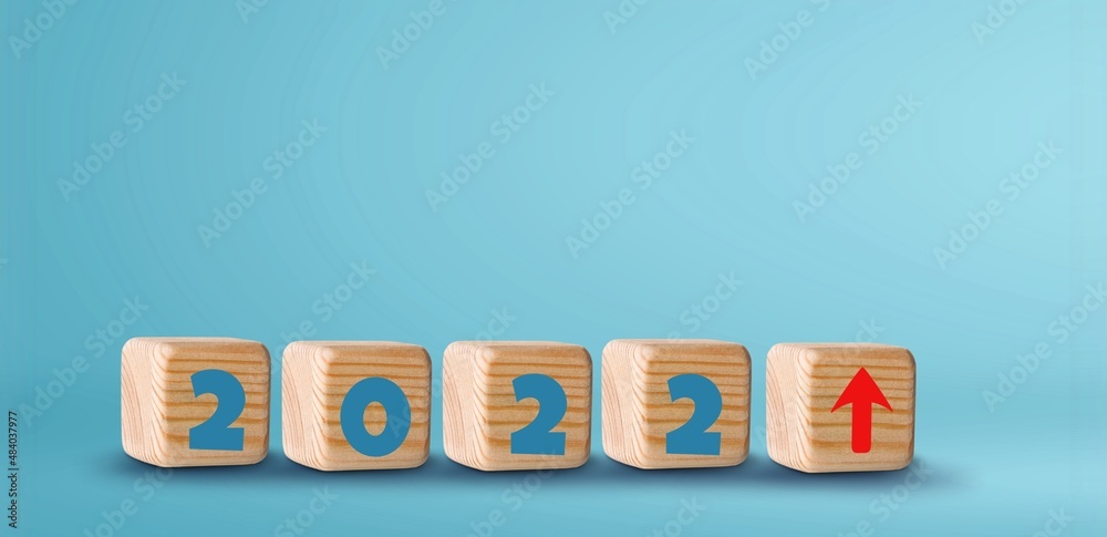 Wooden blocks with new year 2022, arrow up icons, Business development and growth concept