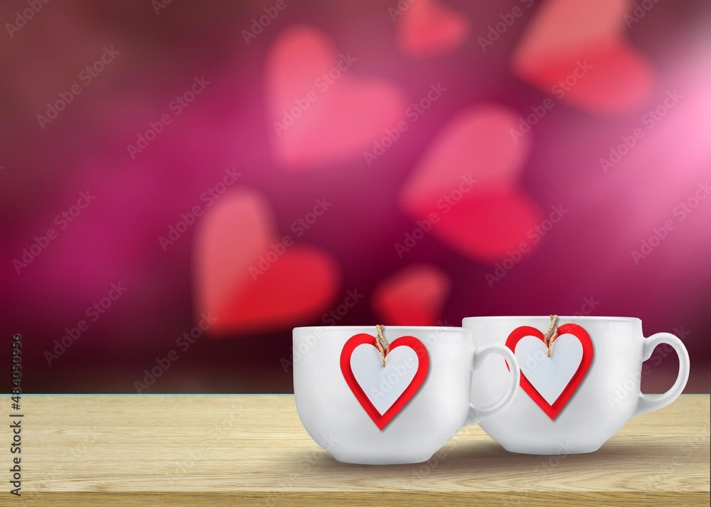 Cups full of love.  A hot heart in a tender embrace. Perfect texture for a greeting card for a loved