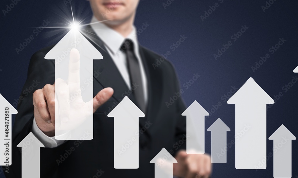 Businessman touching rise up arrow for business and profit growth concept.