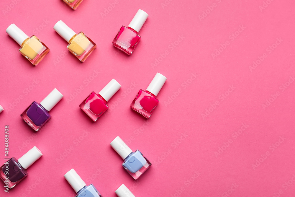 Set of nail polish bottles on color background