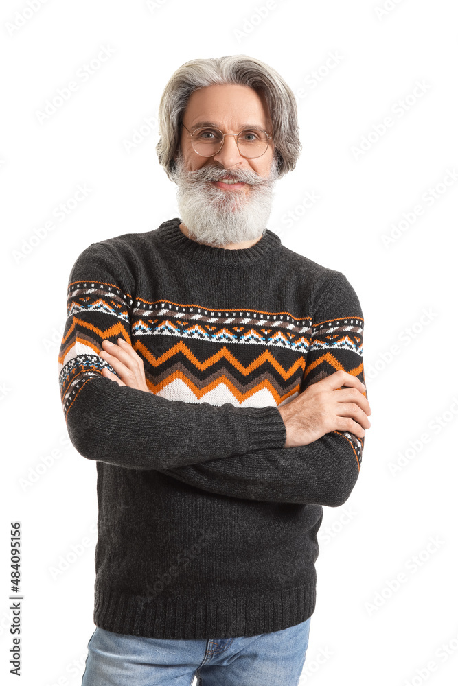 Handsome senior man in knitted sweater on white background