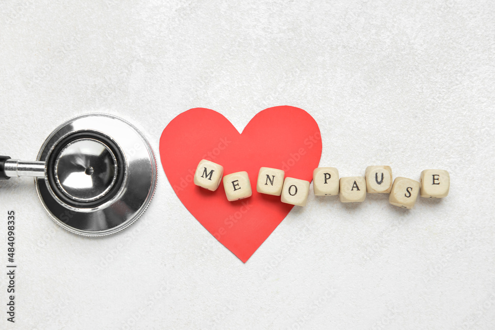 Word MENOPAUSE with paper heart and stethoscope on white background（白底纸心听诊器）