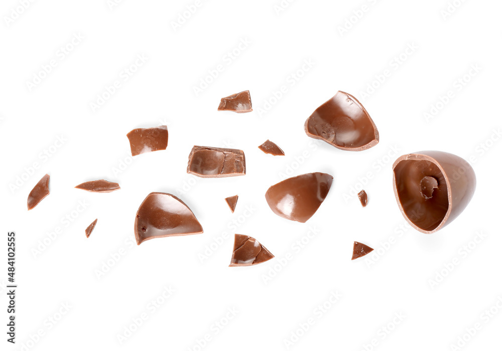 Broken chocolate Easter egg isolated on white background