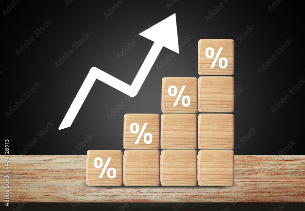 Wooden block signs and symbols with percentage and up arrow financial and business growth