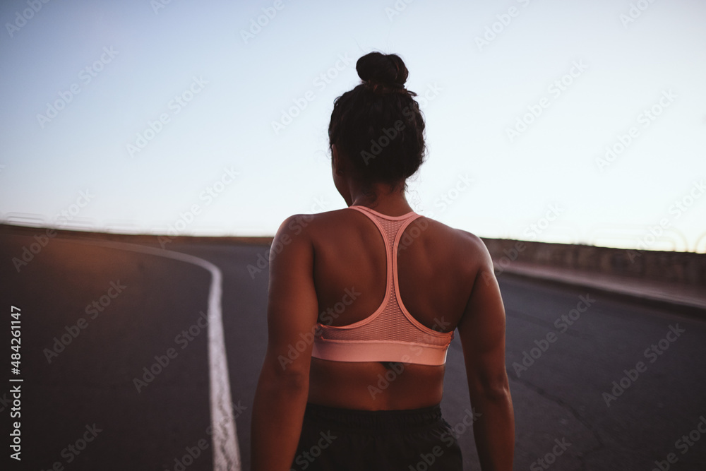 Young African woman preparing for an early morning road run