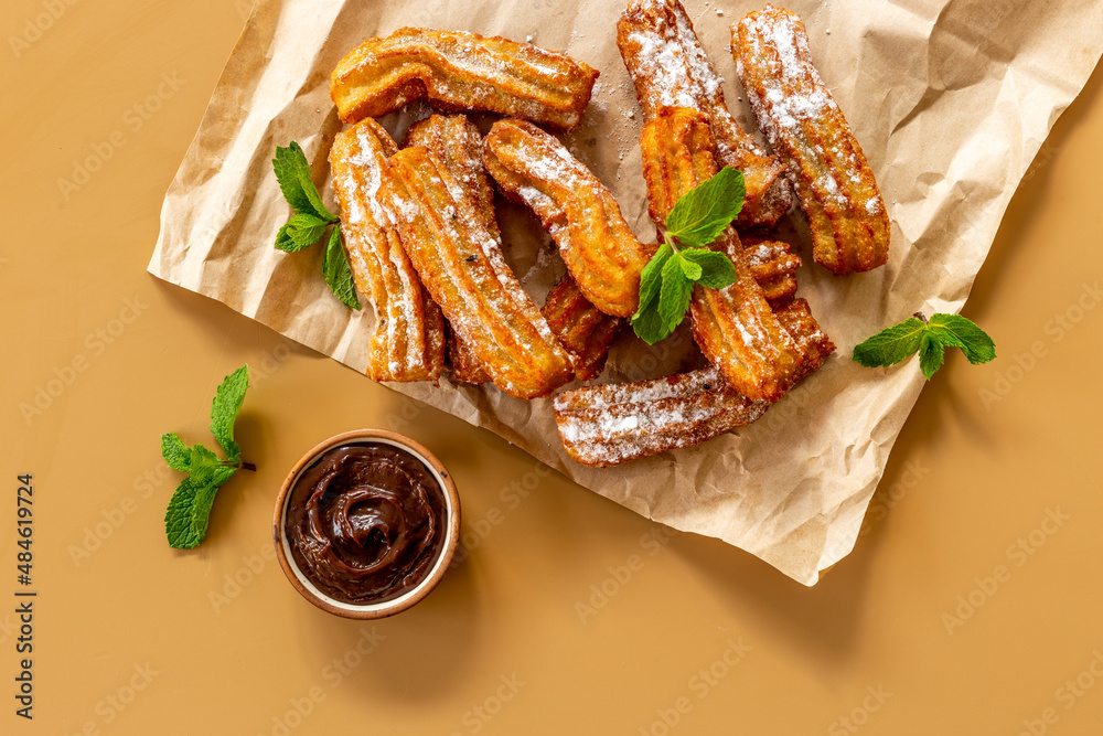 Spanish churros waffles on baking paper, top view