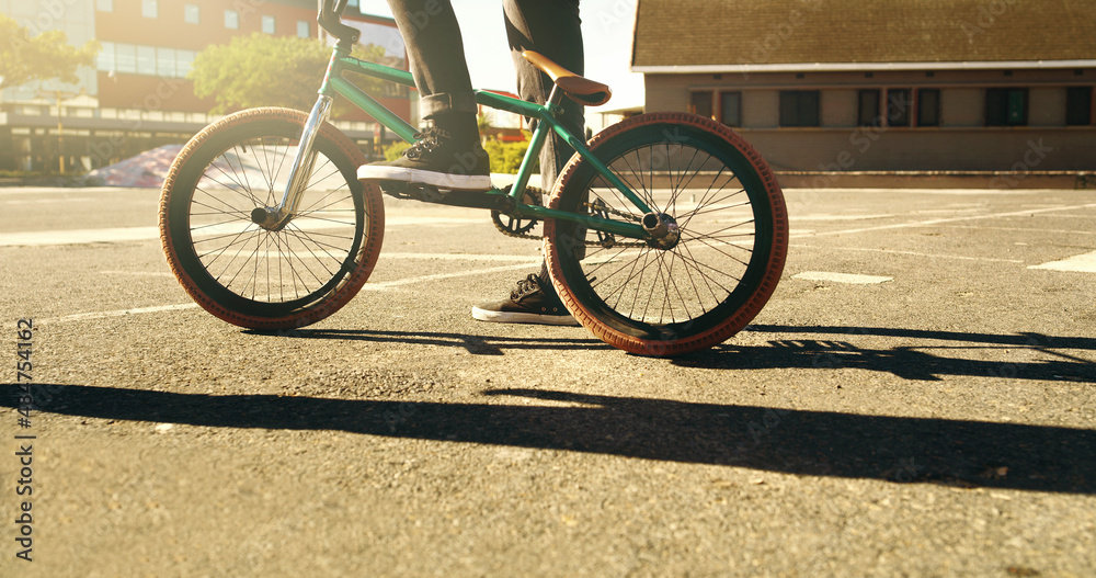 Ready to ride. Cropped shot of an unrecognizable male BMX biker outside.