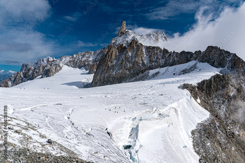 The Geant glacier in the massif of Mont Blanc; in the background the peak of the Dent du Géant (Alps