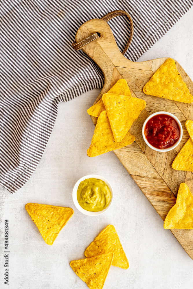 Snack for party corn nachos with salsa and guacamole sauces