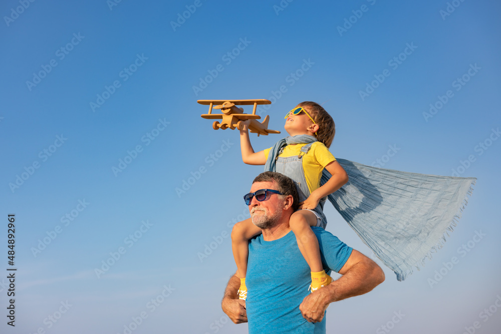 Grandfather and boy having fun outdoor