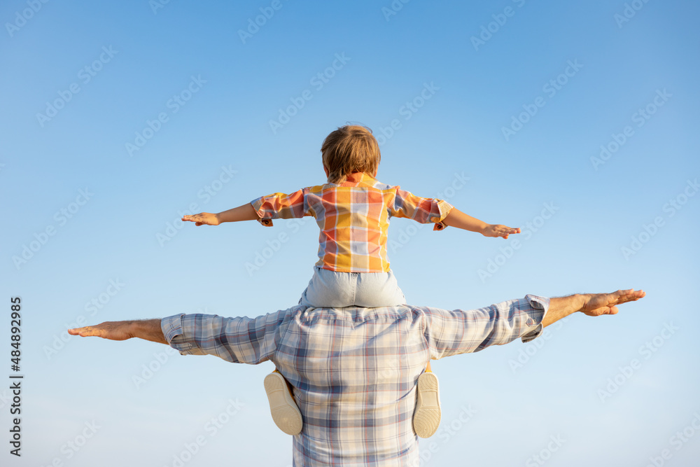 Grandfather and boy having fun outdoor