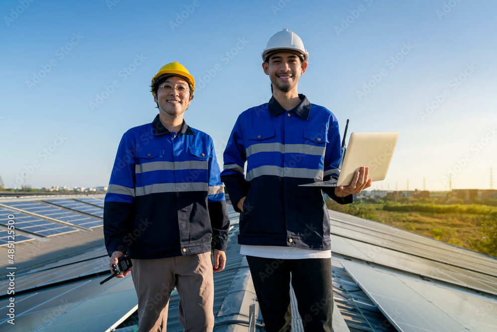 portrait smiling professional engineer with laptop and tablet maintenance checking installing solar 