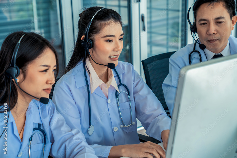 Doctor team wearing headset talking actively on video call in hospital clinic . Concept of telehealt