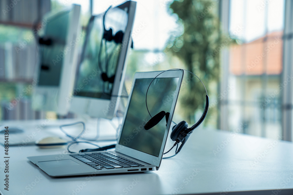 Headset and customer support equipment at call center ready for actively service . Corporate busines