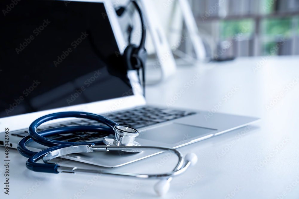 Headset and doctor equipment at clinic ready for actively support for patient by online video call .