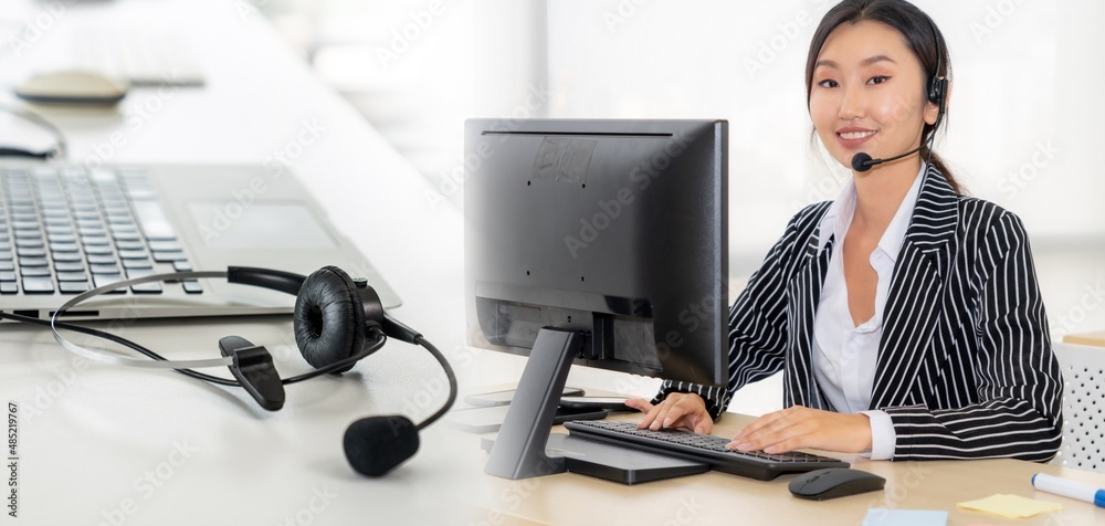 Business people wearing headset working in office to support remote customer or colleague. Call cent