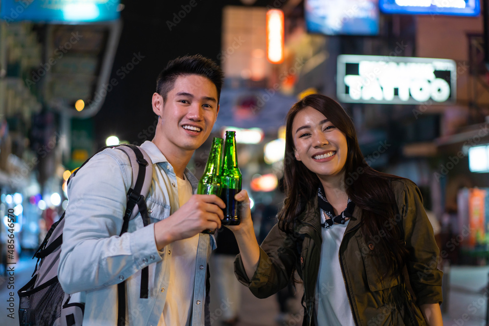 Portrait of Asian couple drinking alcohol and having party together. 