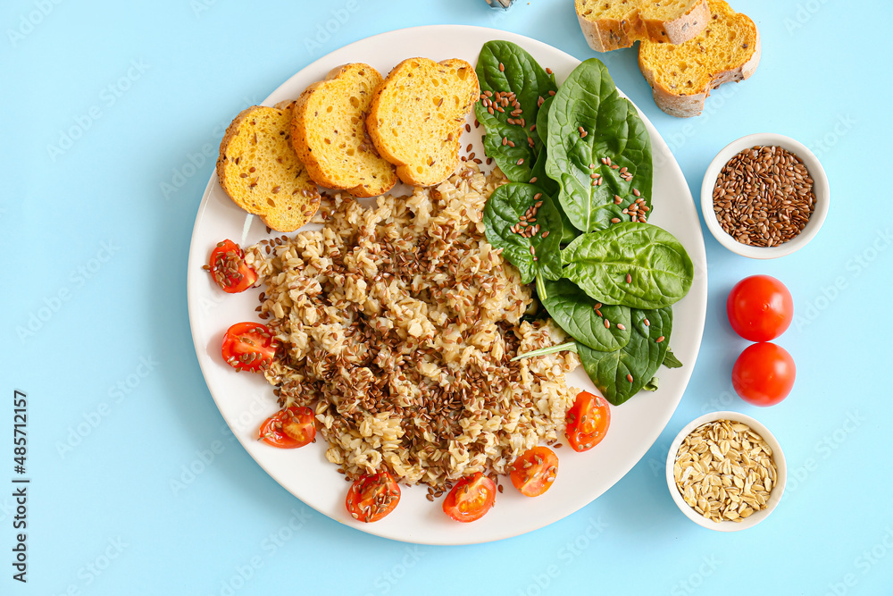 Plate with tasty breakfast on color background