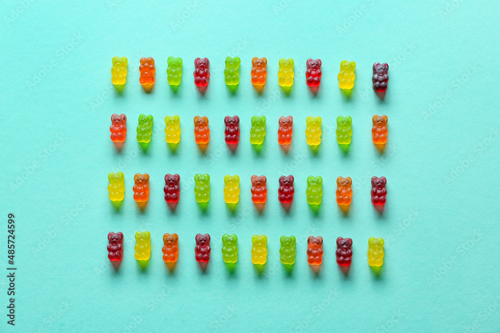 Sweet jelly bears on turquoise background