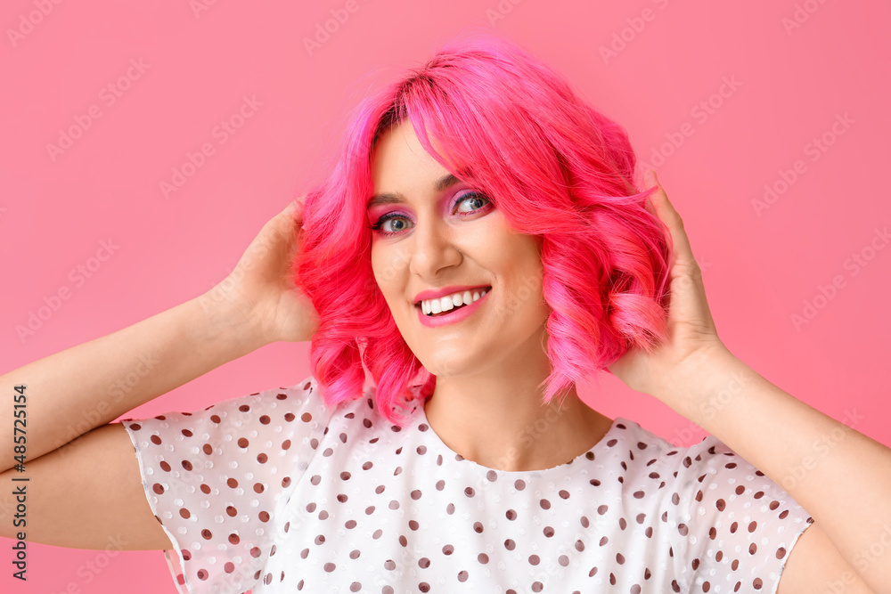 Stylish woman with bright hair on color background