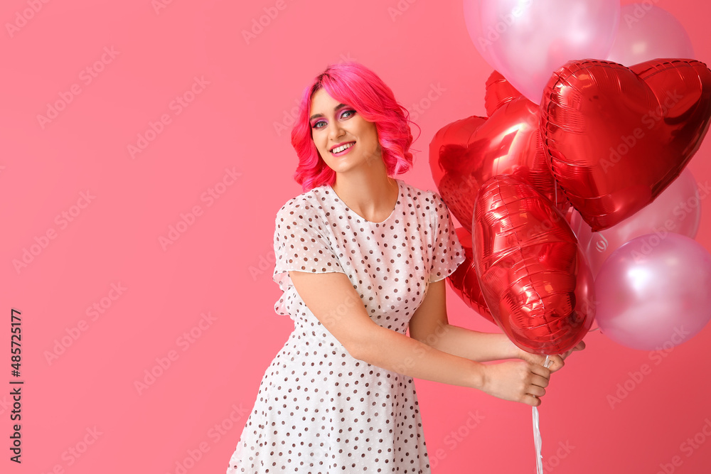 Stylish woman with bright hair and air balloons on color background. Valentines Day celebration