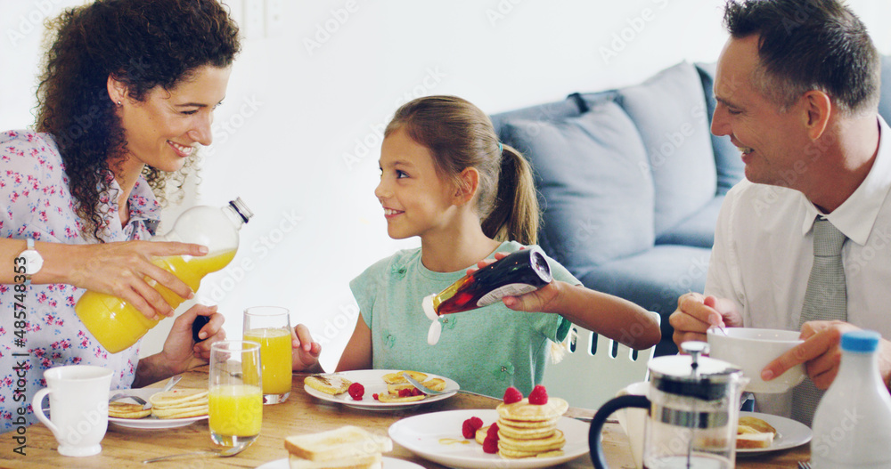 The family bonding experience starts at breakfast. Shot of a cute little girl having breakfast with 