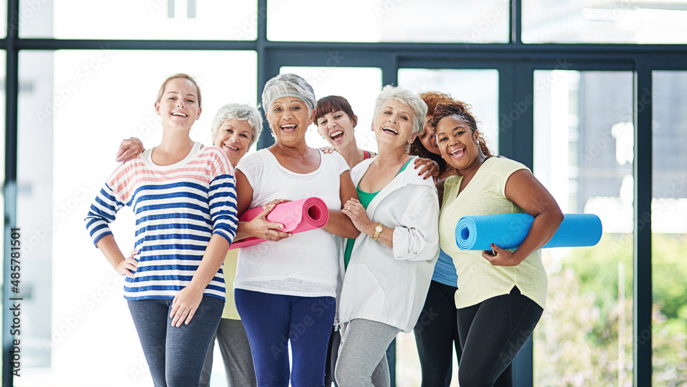 Young and old...everyone should exercise. Shot of a group of women waiting for yoga class to begin.