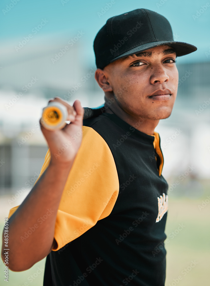 I dont run away from challenges, I run over them. Shot of a young baseball player holding a baseball