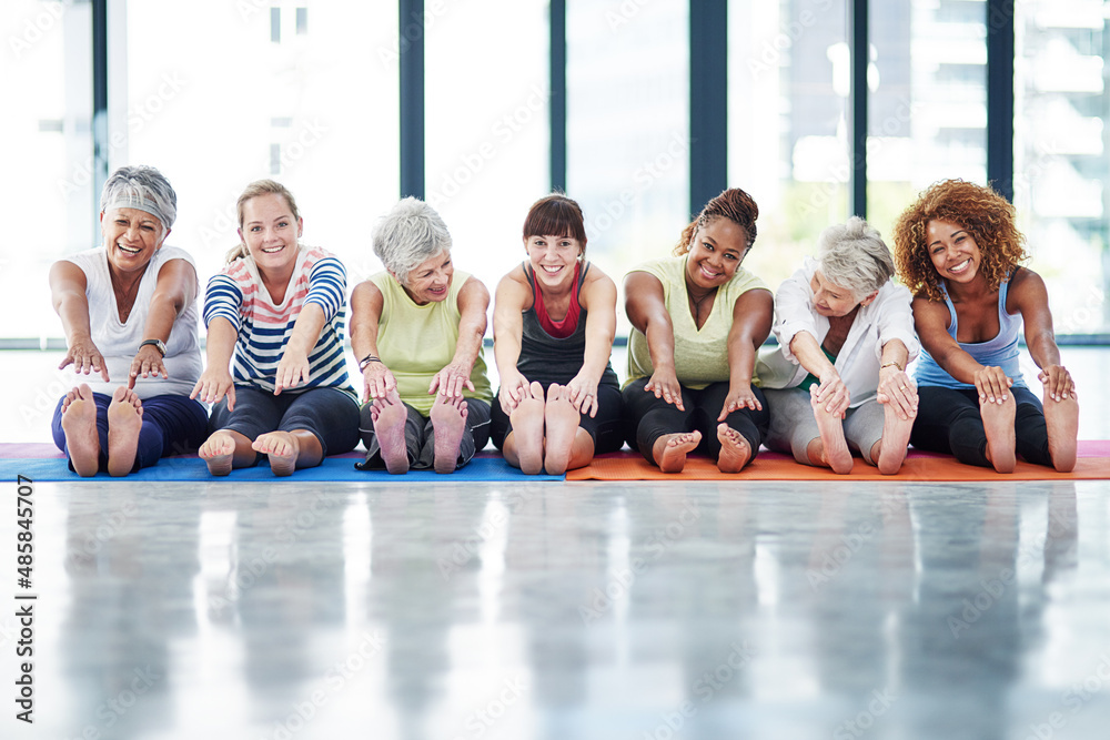 We never forget to warmup. Shot of a group of women warming up indoors.