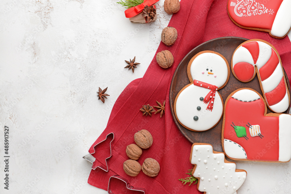 Tasty Christmas cookies on light background