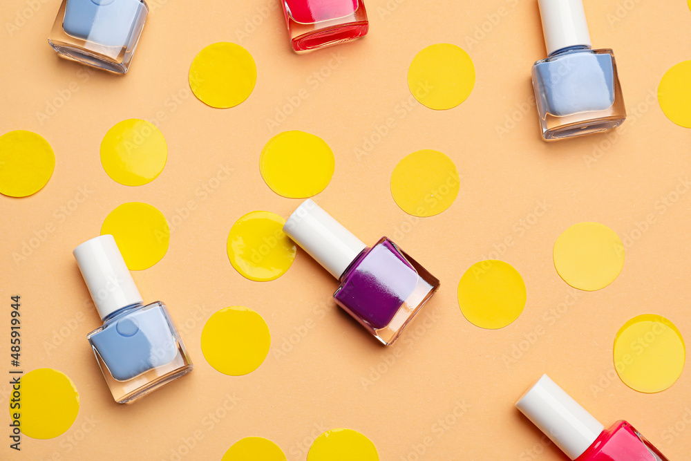 Set of nail polish bottles on color background