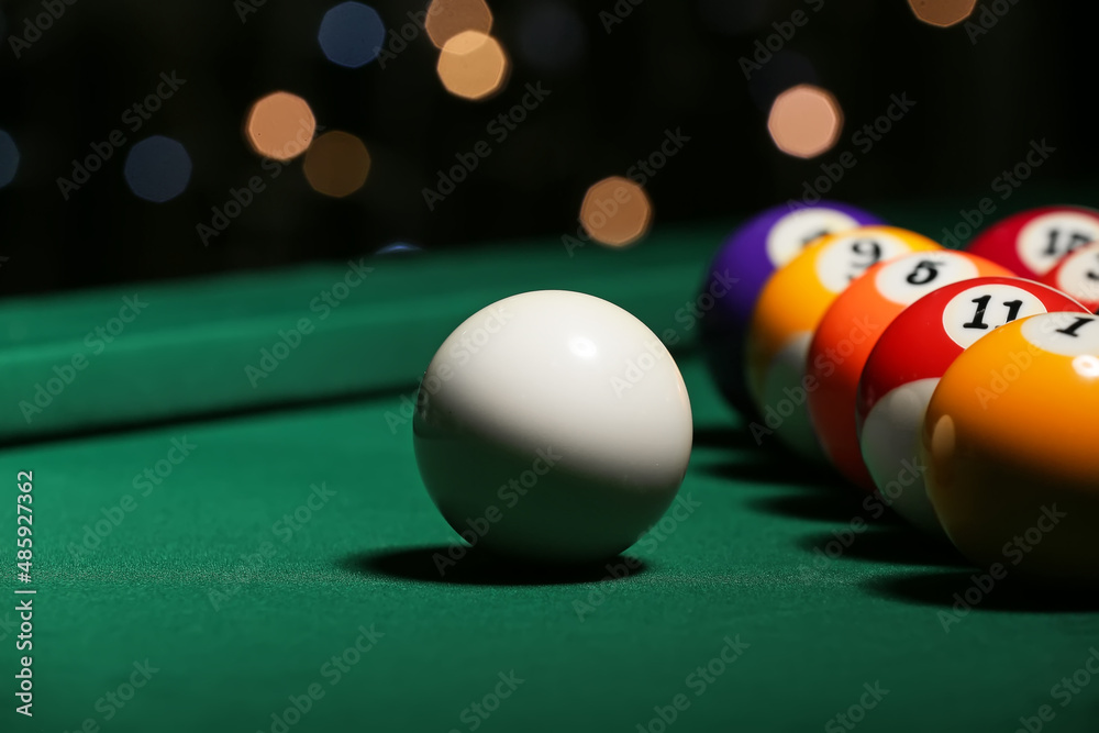 Different billiard balls on green table