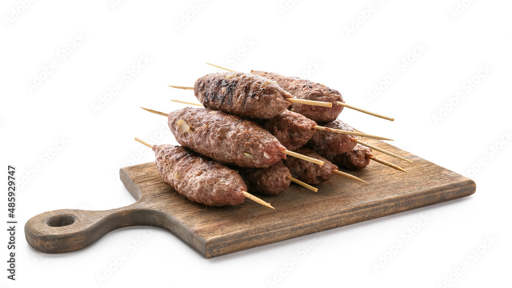 Wooden board of skewers with tasty lula kebab isolated on white background