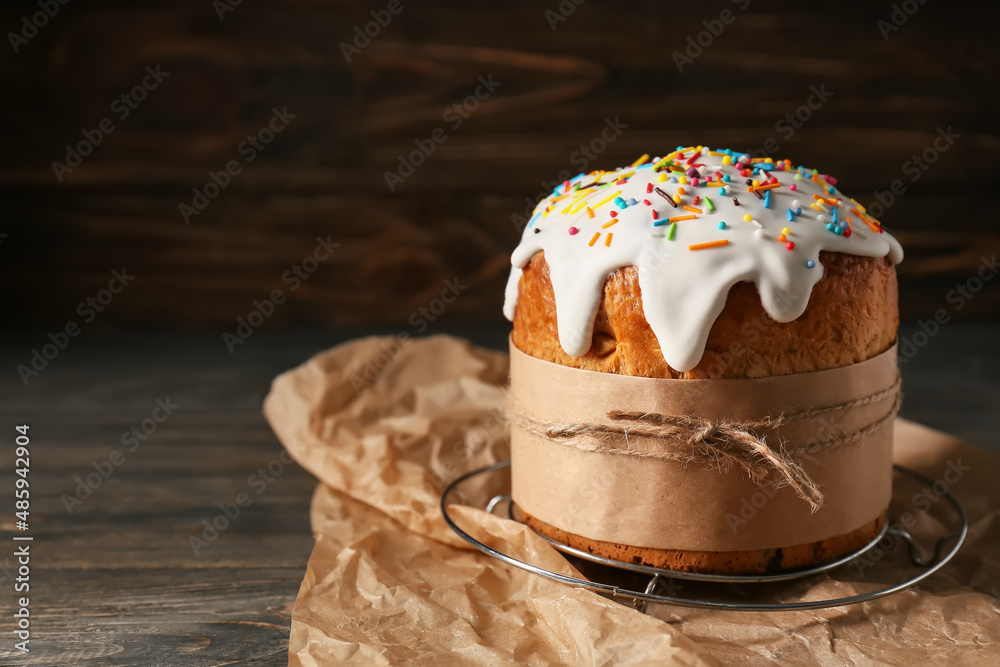 Delicious Easter cake on wooden background