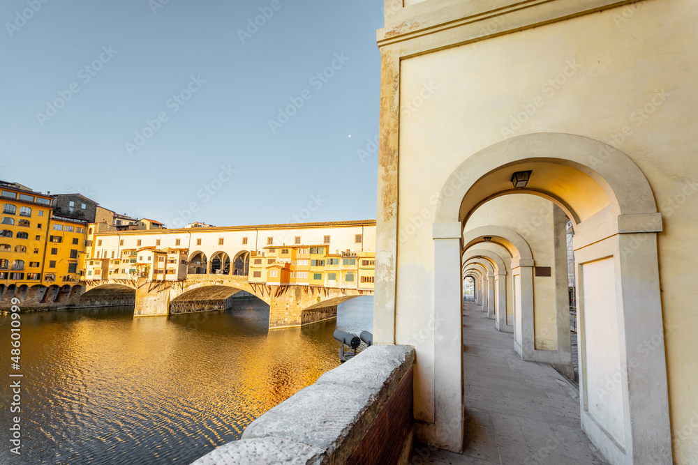 Morning view on famous Old bridge called Ponte Vecchio and arcade on Arno river in Florence, Italy. 