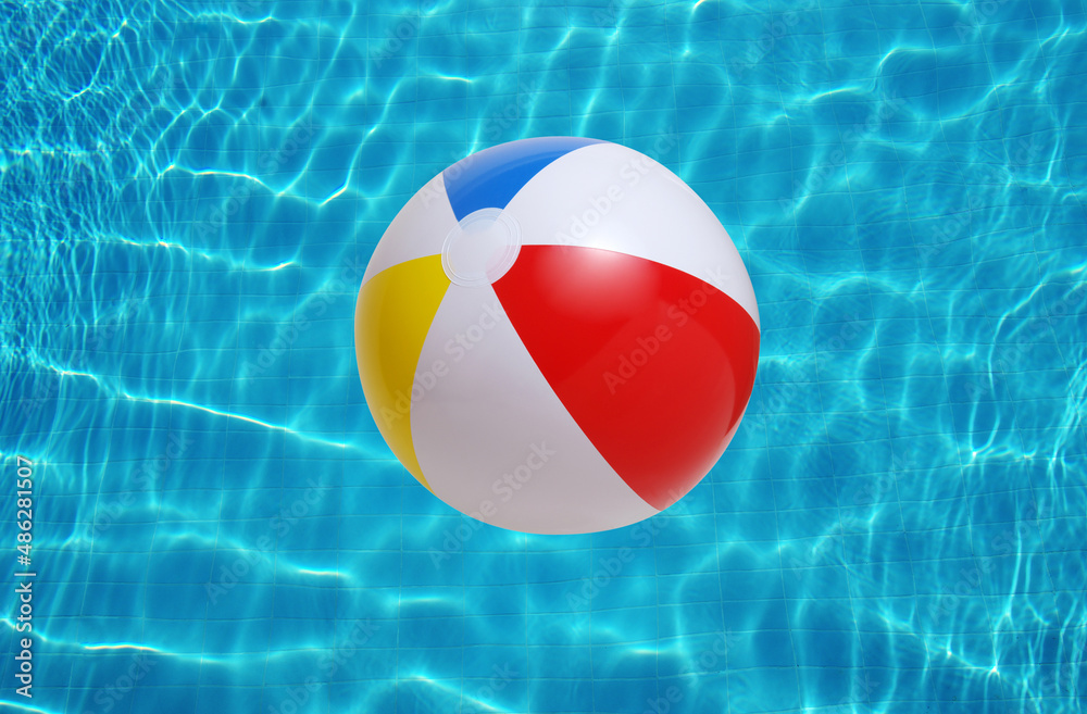 Beach ball in swimming pool