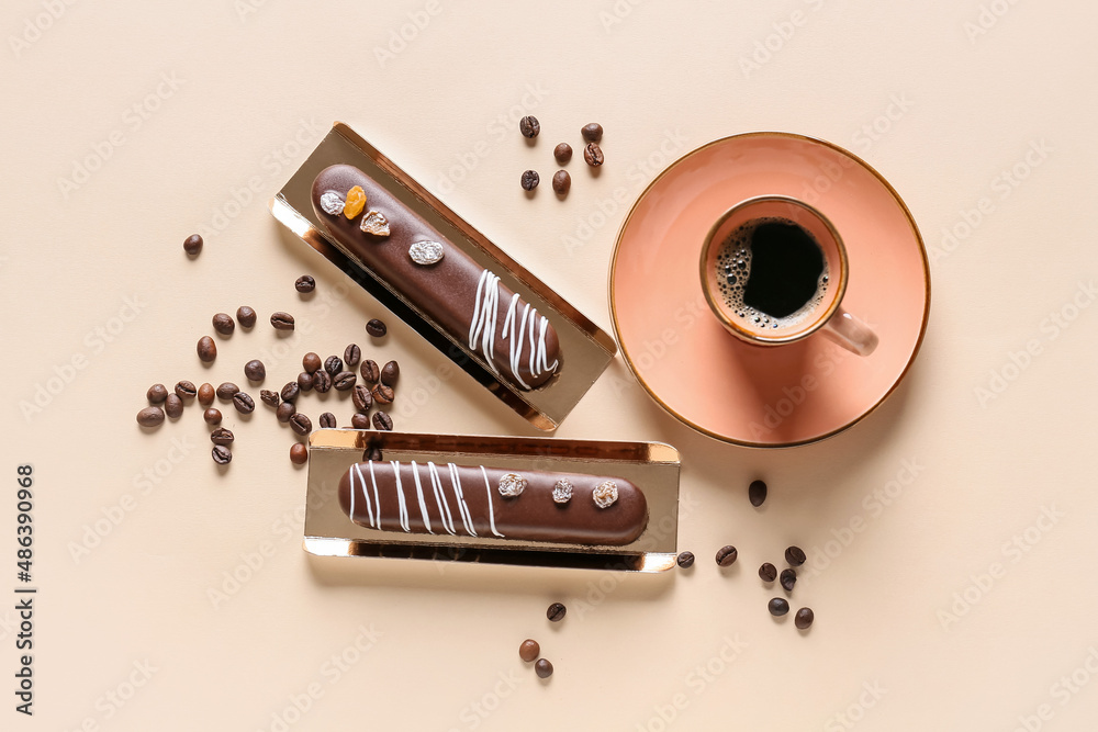 Delicious chocolate cakes and cup of coffee on light background