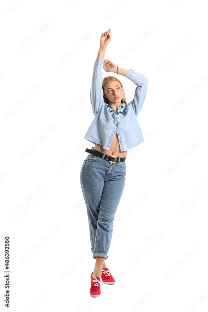 Fashionable young woman in stylish jeans clothes on white background