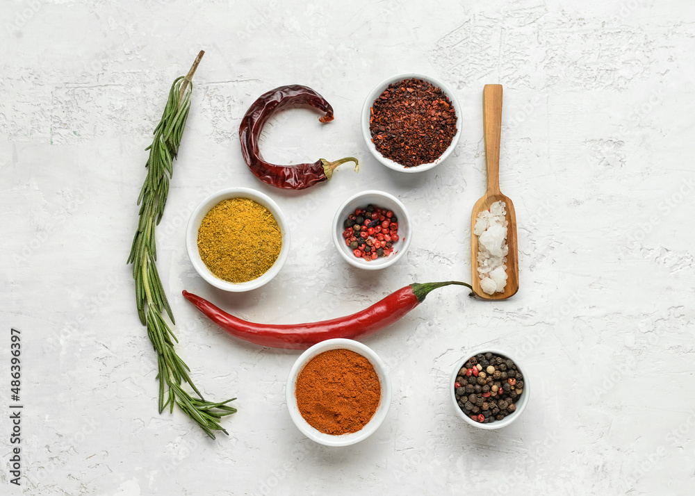 Composition with different aromatic spices on light background