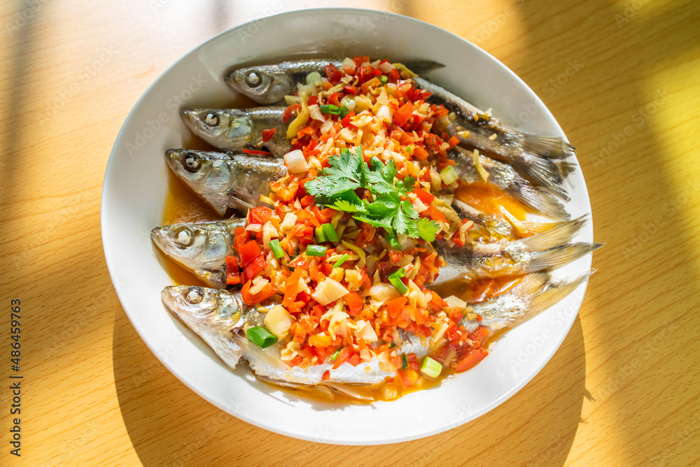 Chinese home-cooked fish with chopped peppers and white strips