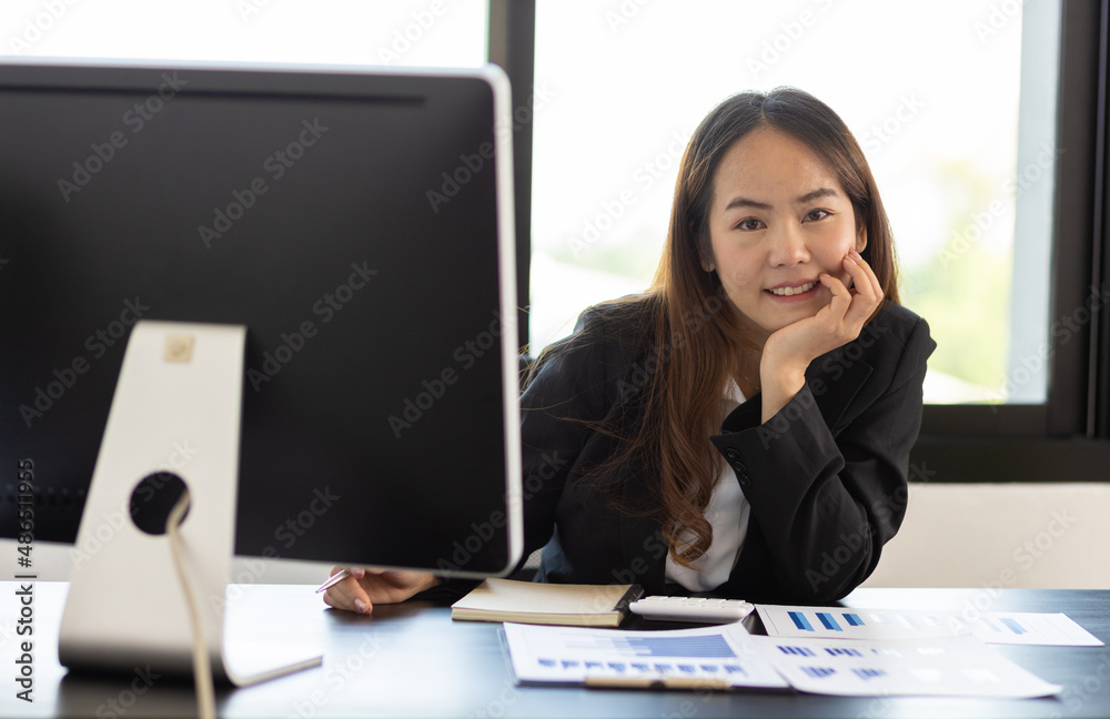 Portrait of a business woman at a desk in the office.