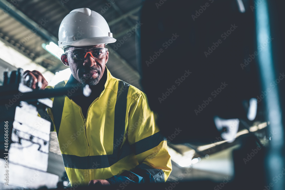 Factory worker or engineer do machine job in adept manufacturing workshop . Industrial people and ma