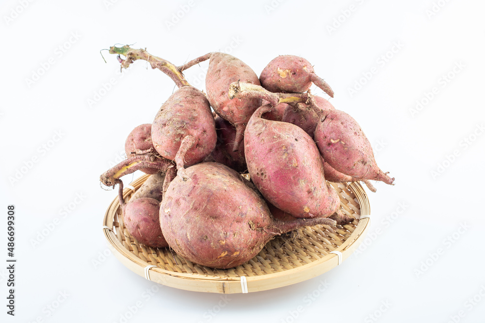 Fresh sweet potatoes on white background