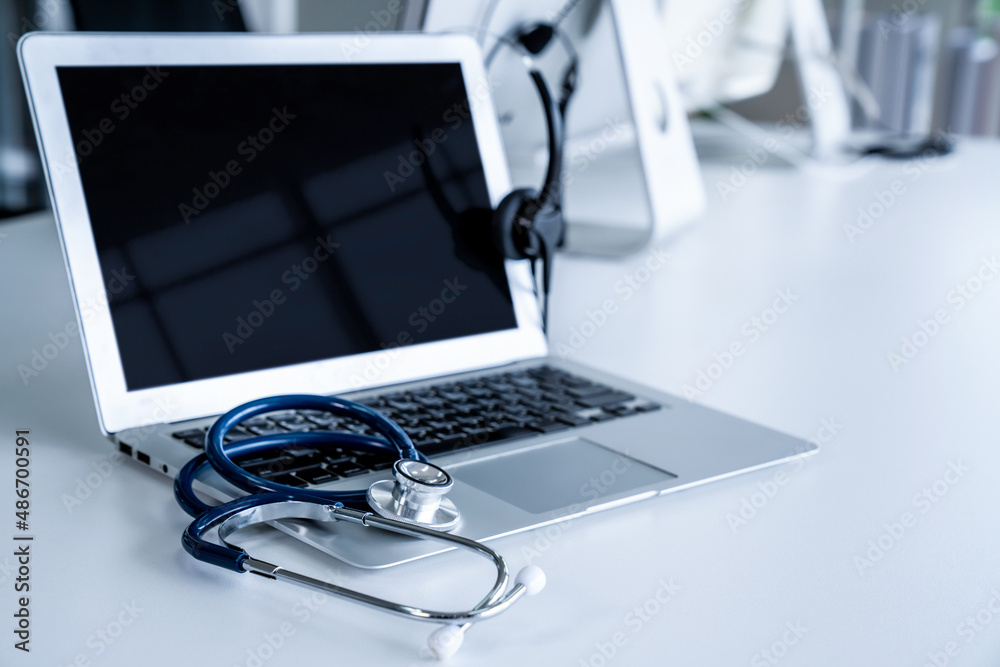 Headset and doctor equipment at clinic ready for actively support for patient by online video call .