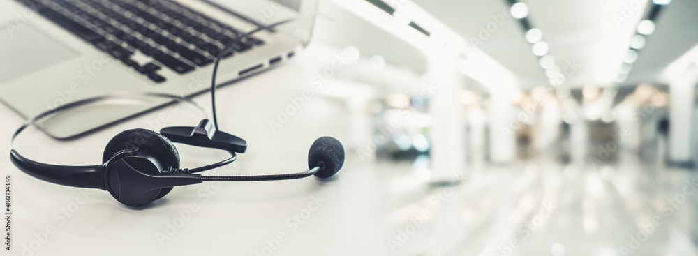 Headset and customer support equipment at call center ready for actively service . Corporate busines