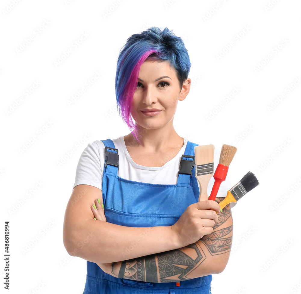 Female painter with bright hair and brushes on white background