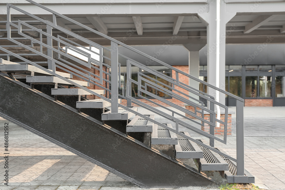 View of modern metal stairs with railing outdoors