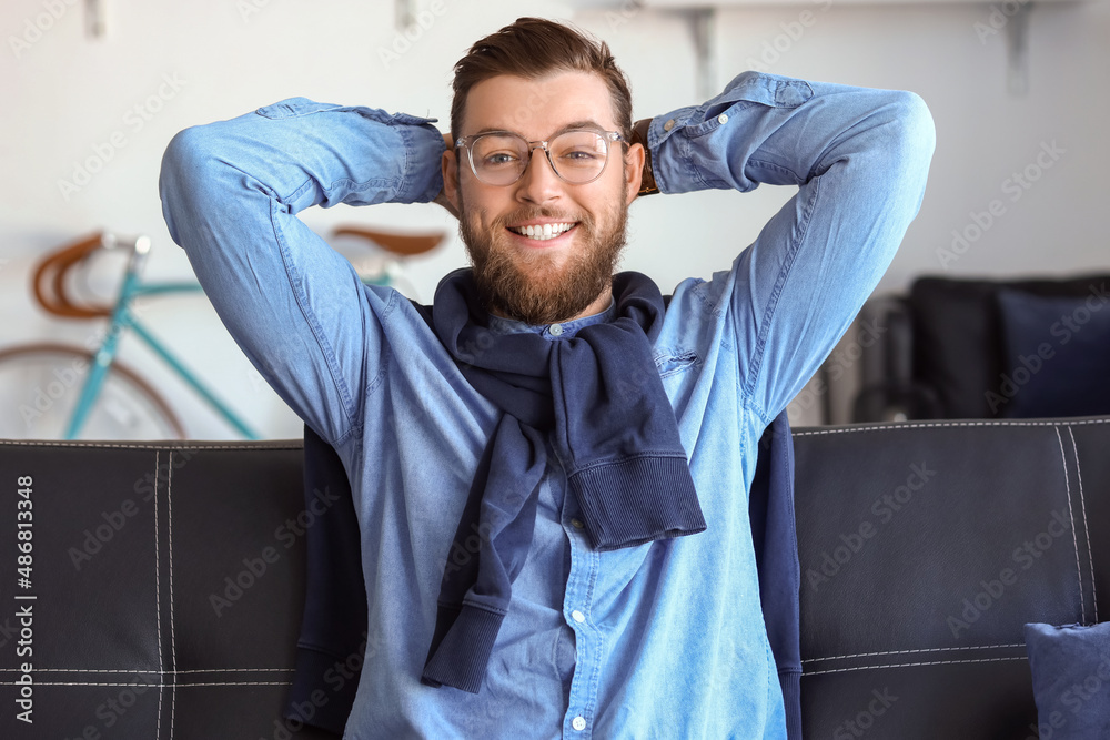 Handsome young man video chatting at home